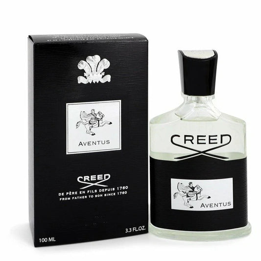 Creed Aventus Eau de Parfum 100ml bottle next to its black packaging box, featuring the iconic Aventus horse logo and black and white design on a white background.